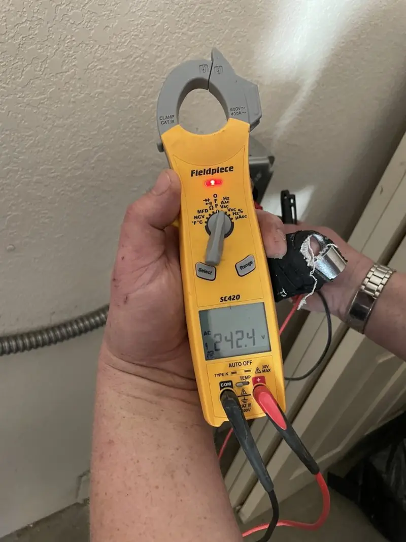 Voltage testing with clamp meter during Recessed Lighting Installation in Louisiana